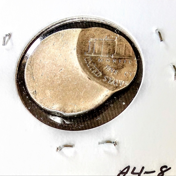 75%off center strike Nickel error